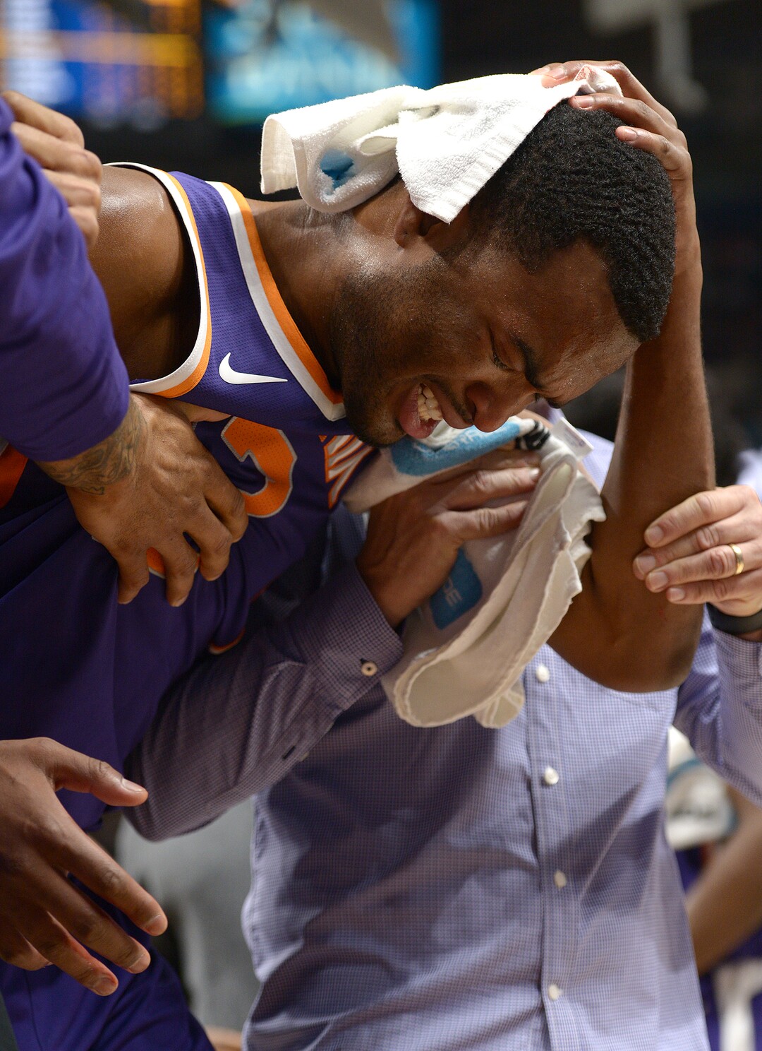 (Leah Hogsten  |  The Salt Lake Tribune) Phoenix Suns forward T.J. Warren (12) leaves the game holding the back of his head in the first half as the Utah Jazz host the Phoenix Suns during preseason NBA basketball at Vivint Smart Home Arena in Salt Lake City, October 6, 2017.