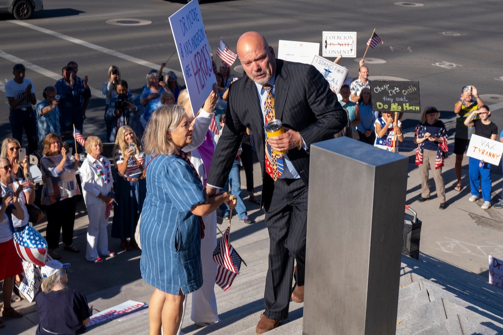 (Rick Egan | The Salt Lake Tribune) Kirk Moore makes his way past his supporters on the steps of the Orrin G. Hatch Federal Courthouse in Salt Lake City on Monday, July 7, 2025. Moore is accused of destroying doses of the COVID-19 vaccine and fraudulently distributing vaccination cards.