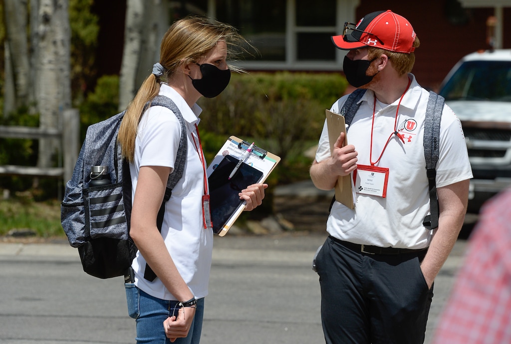 (Francisco Kjolseth  |  Tribune file photo) University of Utah student volunteers McKenna Hunt and Max Schultz set out throughout Park City neighborhoods on Wednesday, May 6, 2020, to tag households with a flyer or door hanger explaining a new project to test for COVID-19 and coronavirus antibodies. The Utah HERO (Health & Economic Recovery Outreach) program is a new undertaking beginning with randomized testing of 10,000 Utahns across four counties. The data gathered will inform decision-makers in the state as they work to help keep residents safe and get people back to work.