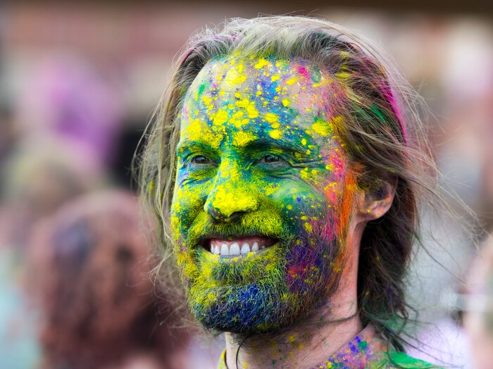 (Rick Egan  |  The Salt Lake Tribune)      Noah Wilson, Boulder, Colorado, watches the entertainment, during the 22nd annual Holi Festival of Colors at the Sri Sri Radha Krishna Temple in Spanish Fork, Saturday, March 24, 2018. The festival which celebrates the beginning or spring is also known as at the Festival of Love.