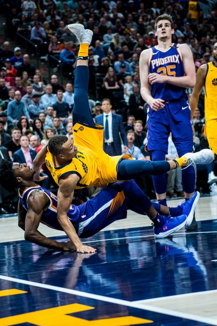 (Chris Detrick  |  The Salt Lake Tribune)  Utah Jazz guard Dante Exum (11) fouls Phoenix Suns guard Josh Jackson (20) during the game at Vivint Smart Home Arena Thursday, March 15, 2018. Utah Jazz defeated Phoenix Suns 116-88.