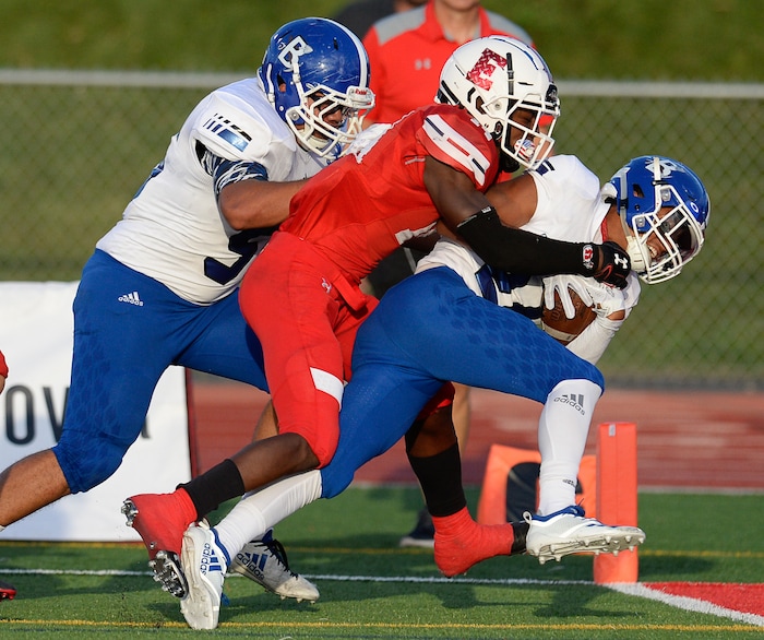 (Francisco Kjolseth  |  The Salt Lake Tribune)  Jared Greenfield of Bingham scores his team's first touchdown on a punt return as he pushes past the East High defense on Friday, Aug. 24, 2018 at East.
