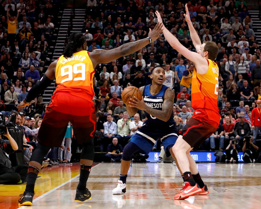 Utah Jazz's Jae Crowder (99) and Joe Ingles, right, defend as Minnesota Timberwolves' Jeff Teague, middle, looks to pass during the first half of an NBA basketball game Friday, March 2, 2018, in Salt Lake City. (AP Photo/Kim Raff)