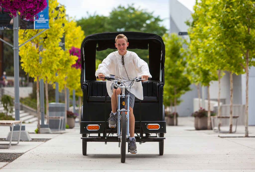 (Jordan Allred | The Spectrum via AP) Caleb Nelson, owner of Romeo's Rickshaws, poses for a photo at the Beverley Taylor Sorenson Center for the Arts in Cedar City, Utah, July 27, 2017.