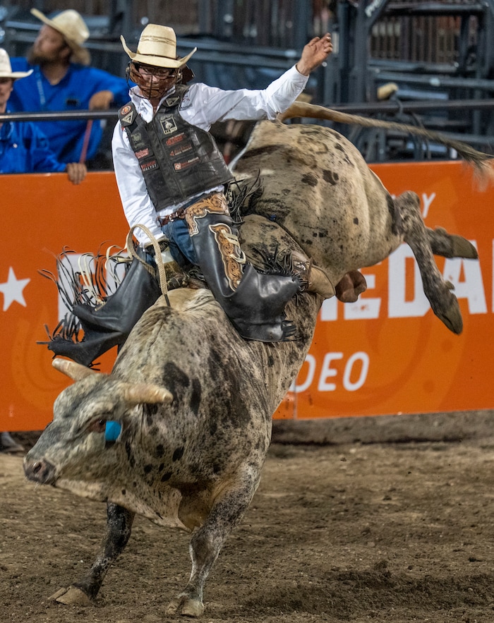 (Rick Egan | The Salt Lake Tribune)  Cole Fischer, from Jefferson City, Mo., competes in bull riding at the Utah Days of '47 Rodeo at the State Fairpark, on Monday, July 25, 2022.