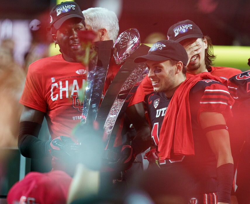 (Leah Hogsten | The Salt Lake Tribune) Utah Utes linebacker Devin Lloyd (0), Utah Utes wide receiver Britain Covey (18) and Utah Utes quarterback Cameron Rising (7) celebrate after winning the Pac-12 title and earning a trip to the Rose Bowl.