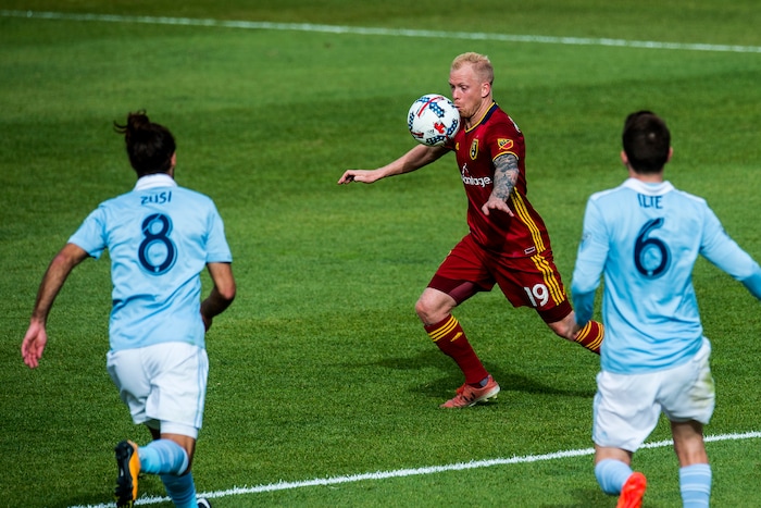 (Chris Detrick  |  The Salt Lake Tribune)  Real Salt Lake midfielder Luke Mulholland (19) Sporting Kansas City midfielder Graham Zusi (8) and Sporting Kansas City midfielder Ilie Sanchez (6) during the game at Rio Tinto Stadium Sunday, October 22, 2017.  