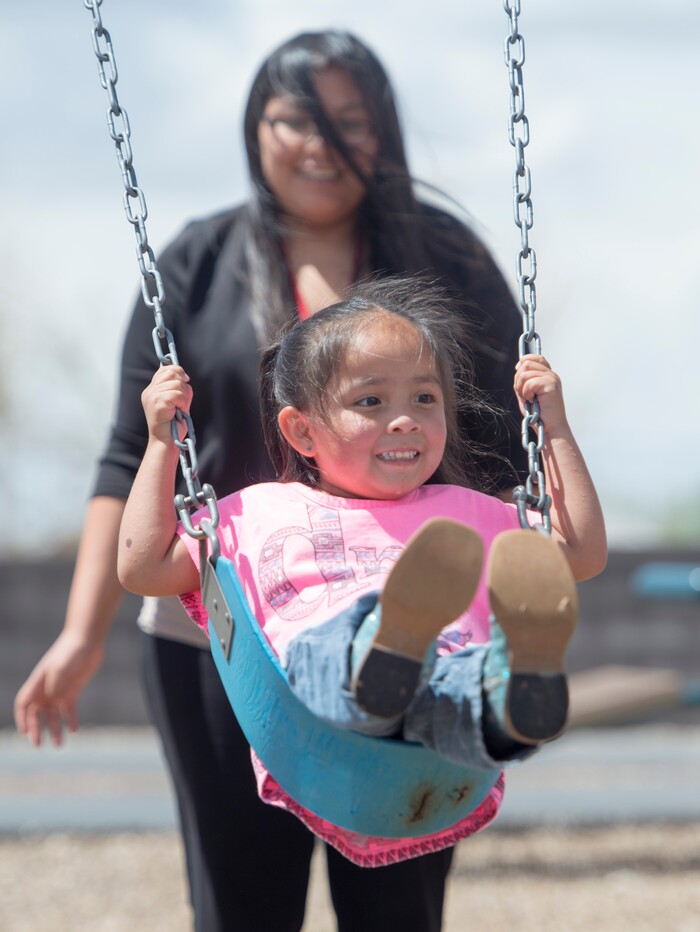 (Rick Egan  |  Tribune File Photo)  Laurel Yellowhorse plays with her 3-year-old daughter RaeLynn, at the playground near the Paiute Tribal office in Cedar City, Wednesday, May 6, 2015.