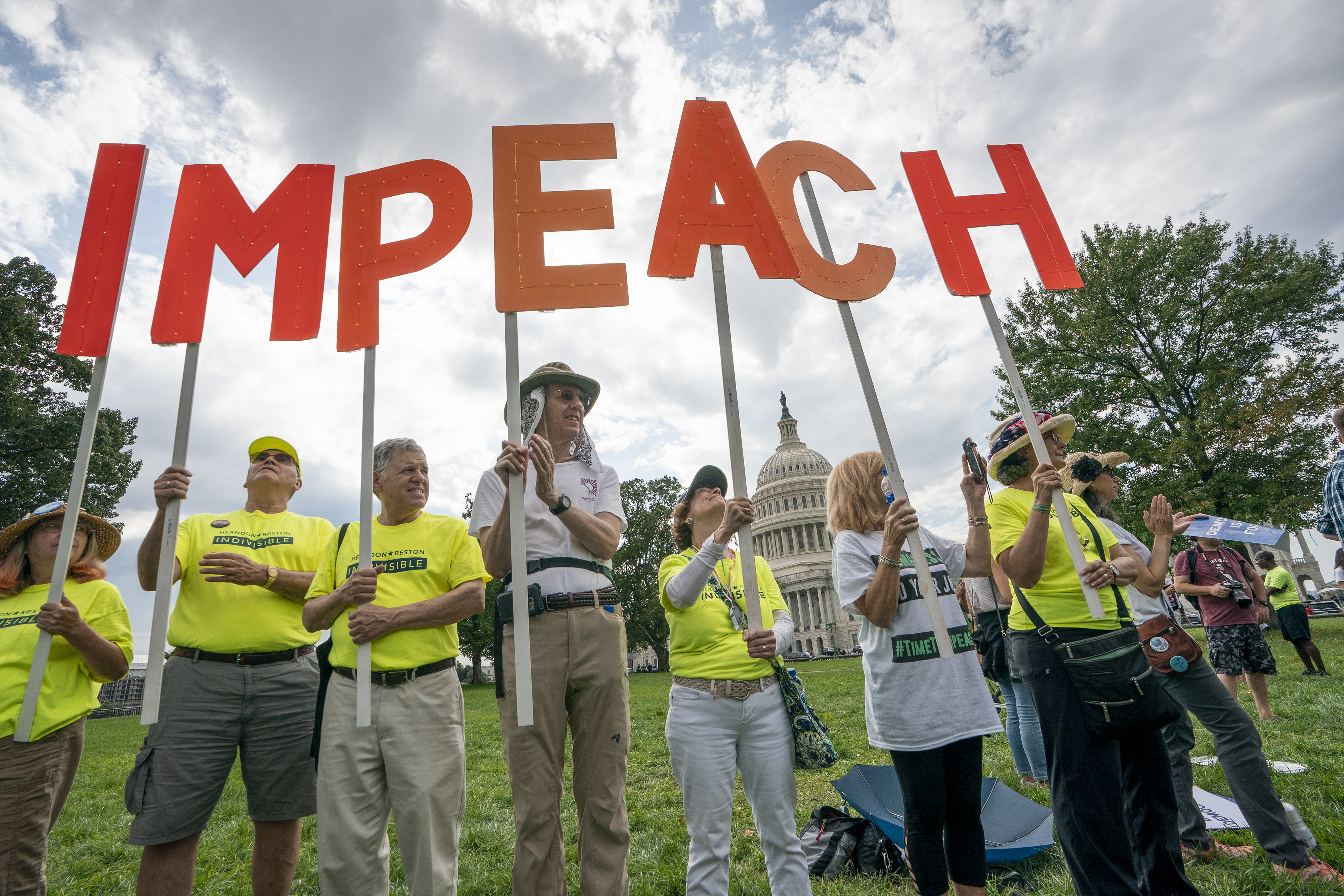 (J. Scott Applewhite | AP) Activists rally for the impeachment of President Donald Trump, at the Capitol in Washington, Thursday, Sept. 26, 2019. Speaker of the House Nancy Pelosi, D-Calif., committed Tuesday to launching a formal impeachment inquiry against Trump.