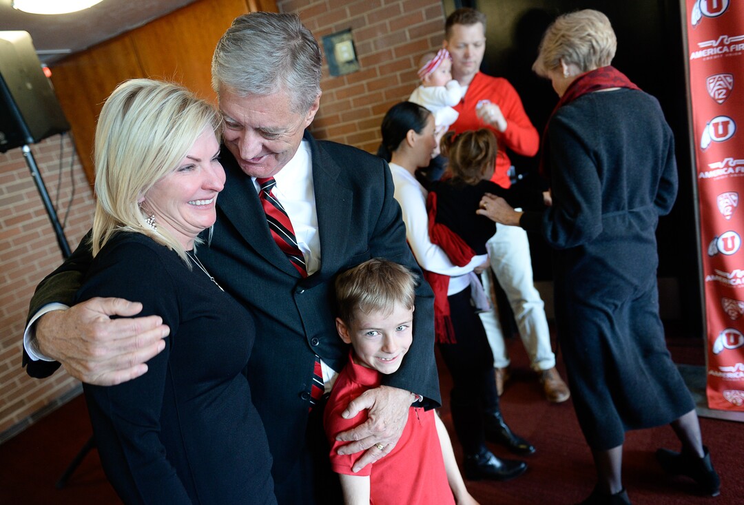 (Francisco Kjolseth  |  The Salt Lake Tribune)  University of Utah Athletics Director Chris Hill embraces his daughter Aly Hill and her son Jack Forsyth, 7, after announcing his plan to retire this spring after 31years. Joined by his wife Kathy and their kids and grandkids at the Jon M. Huntsman Center on campus on Monday, March 26, 2018, Hill is the longest actively tenured athletics director at the same school in the NCAA FBS.