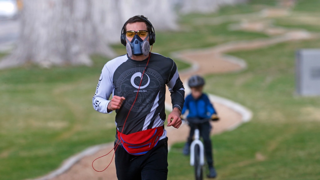 (AP Photo | Rick Bowmer) Tom Watson runs in Liberty Park while wearing a mask Monday, March 23, 2020, Salt Lake City.