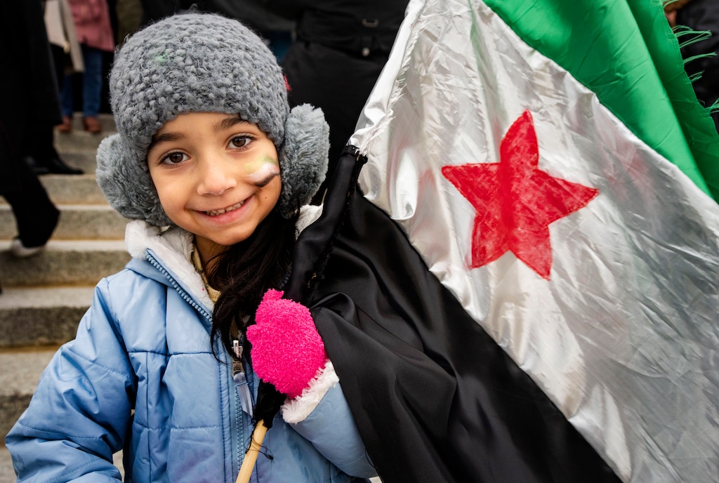 (Rick Egan | The Salt Lake Tribune) A girl named Elaph, 5, holds a flag as Syrian Americans celebrate the liberation of Syria and the end of the Assad regime's tyranny, on the steps of the Capitol, on Saturday, Dec 14, 2024.