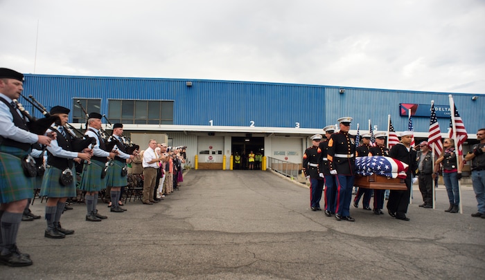 (Rick Egan  |  The Salt Lake Tribune)      The remains of Marine Pfc. Robert K. Holmes are carried from the Delta Air Cargo to a hearse for transportation to the mortuary.  Holmes died aboard the USS Oklahoma during the attack on Pearl Harbor. Friday, Aug. 17, 2018.