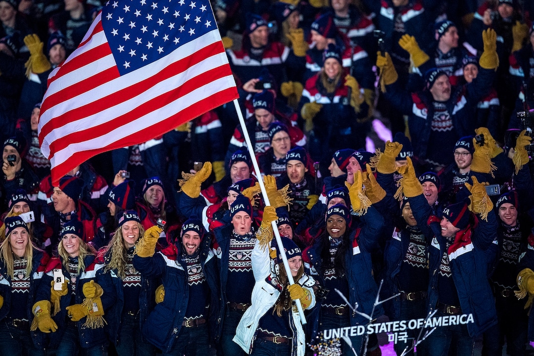 (Chris Detrick  |  The Salt Lake Tribune)  U.S. luger Erin Hamlin carries the American flag during the Pyeongchang 2018 Winter Olympics opening ceremony at Olympic Stadium Friday, February 9, 2018.  