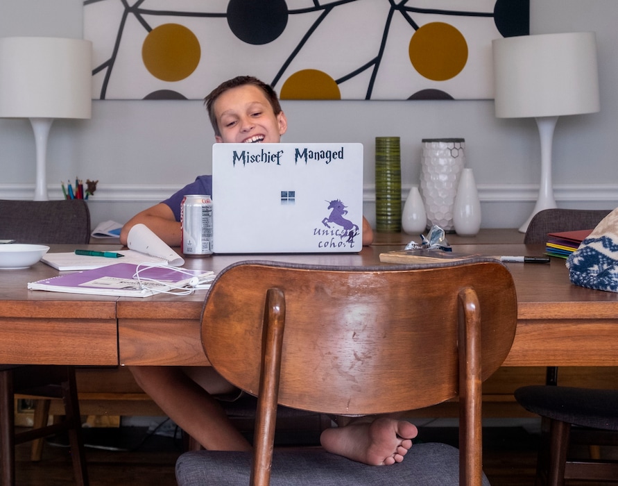 (Leah Hogsten  |  The Salt Lake Tribune) Miles Jones, then a sixth grader at Unitah Elementary School, laughs during the  first day of classes online for the 2020-21 school year in the Salt Lake City School District, on Sept. 14, 2020.