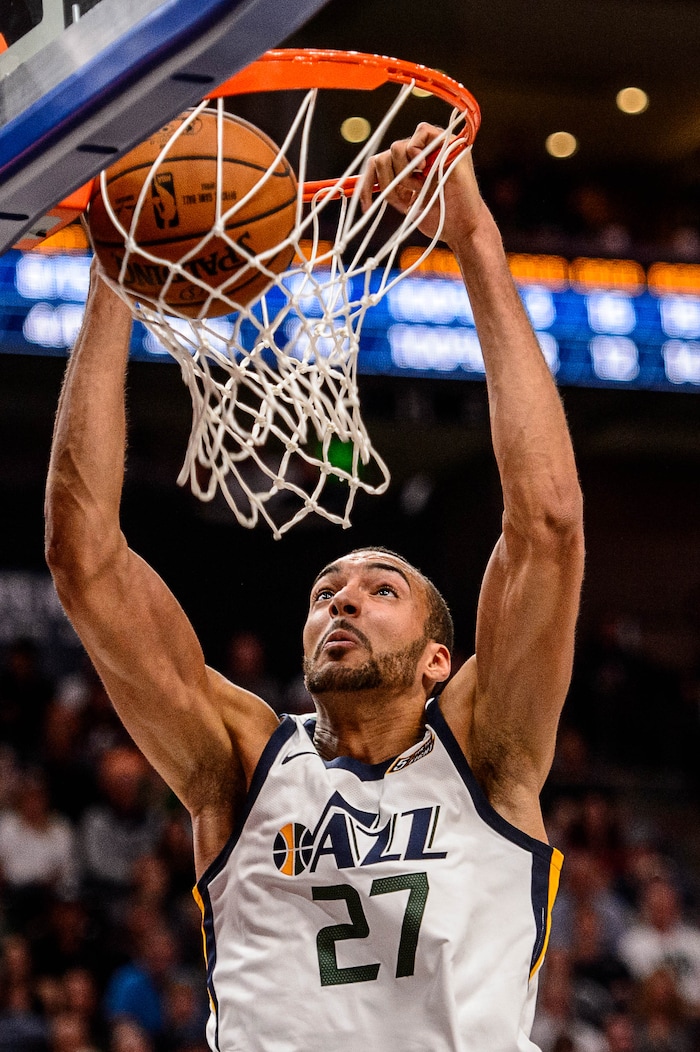 (Trent Nelson | The Salt Lake Tribune)  Utah Jazz center Rudy Gobert (27) dunks the ball as the Utah Jazz host the Denver Nuggets, NBA basketball in Salt Lake City, Wednesday October 18, 2017.