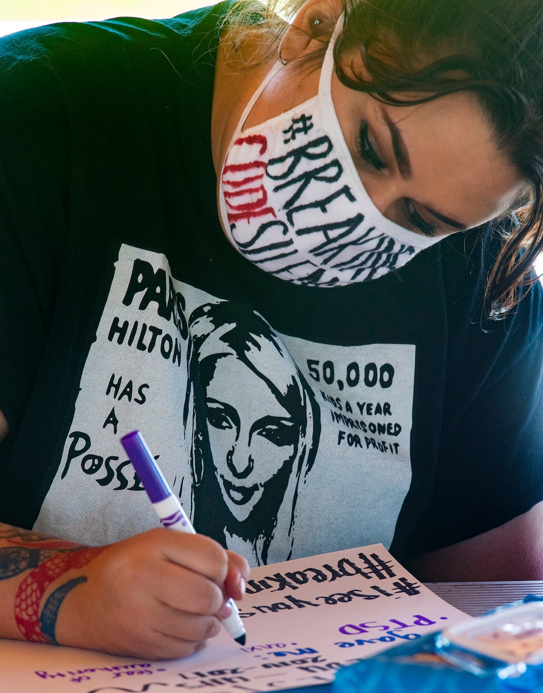 (Rick Egan  |  The Salt Lake Tribune)    Survivor Laura Rouse, from Hawaii, make a sign, during a rally calling for the closure of Provo Canyon School, a residential treatment center in Utah she attended when she was a teen, on Friday, Oct. 9, 2020.