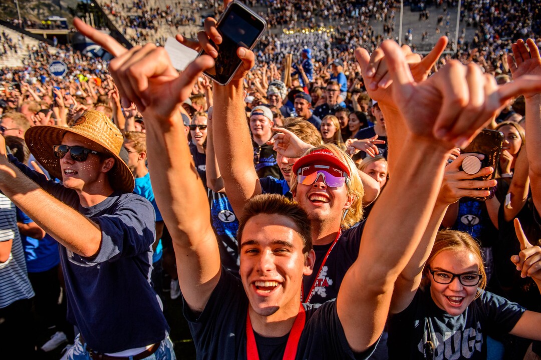 (Trent Nelson  |  The Salt Lake Tribune)  BYU fans rush the field to celebrate the overtime win as BYU hosts USC, NCAA football in Provo on Saturday Sept. 14, 2019.