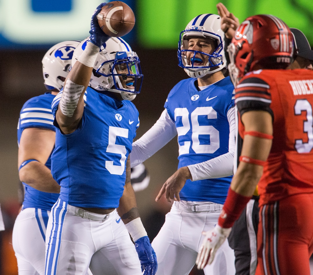(Rick Egan  |  The Salt Lake Tribune)      Brigham Young Cougars place kicker Rhett Almond (26) celebrates with Brigham Young Cougars defensive back Dayan Ghanwoloku (5) after he recovered a Utah fumble, in football action between the Brigham Young Cougars and the Utah Utes, at Rice-Eccles Stadium, Saturday, November 24, 2018.