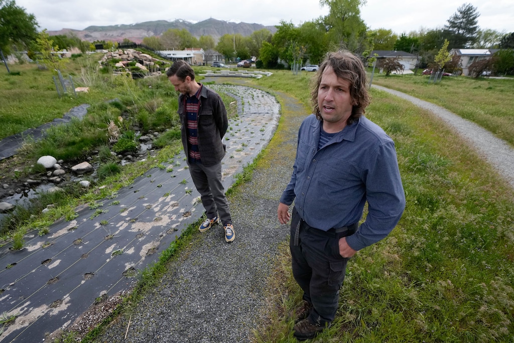 (Francisco Kjolseth | The Salt Lake Tribune) Tyler Murdock, deputy director of Salt Lake City's Public Lands Department, left, and restoration ecologist Blake Wellard tour the Cornell wetland area in Salt Lake City on Wednesday, May 8, 2024.