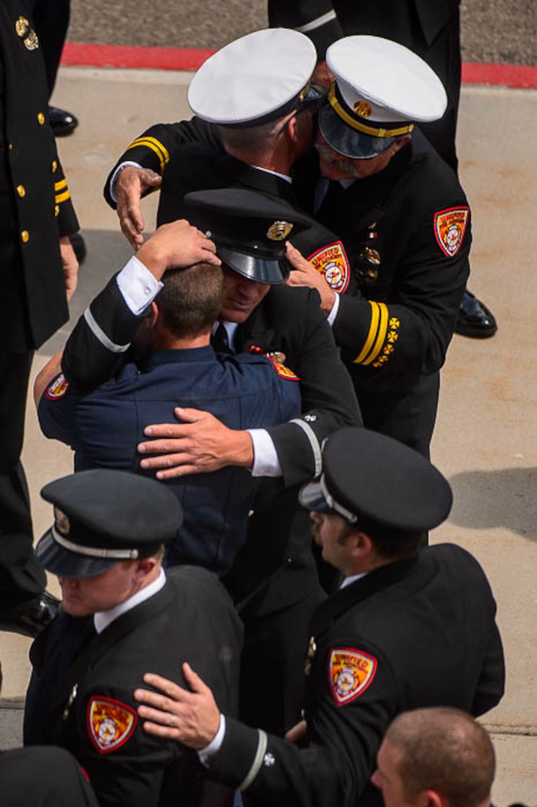 (Trent Nelson | The Salt Lake Tribune)  Funeral services for Battalion Chief Matthew Burchett at the Maverik Center in West Valley City, Monday Aug. 20, 2018.