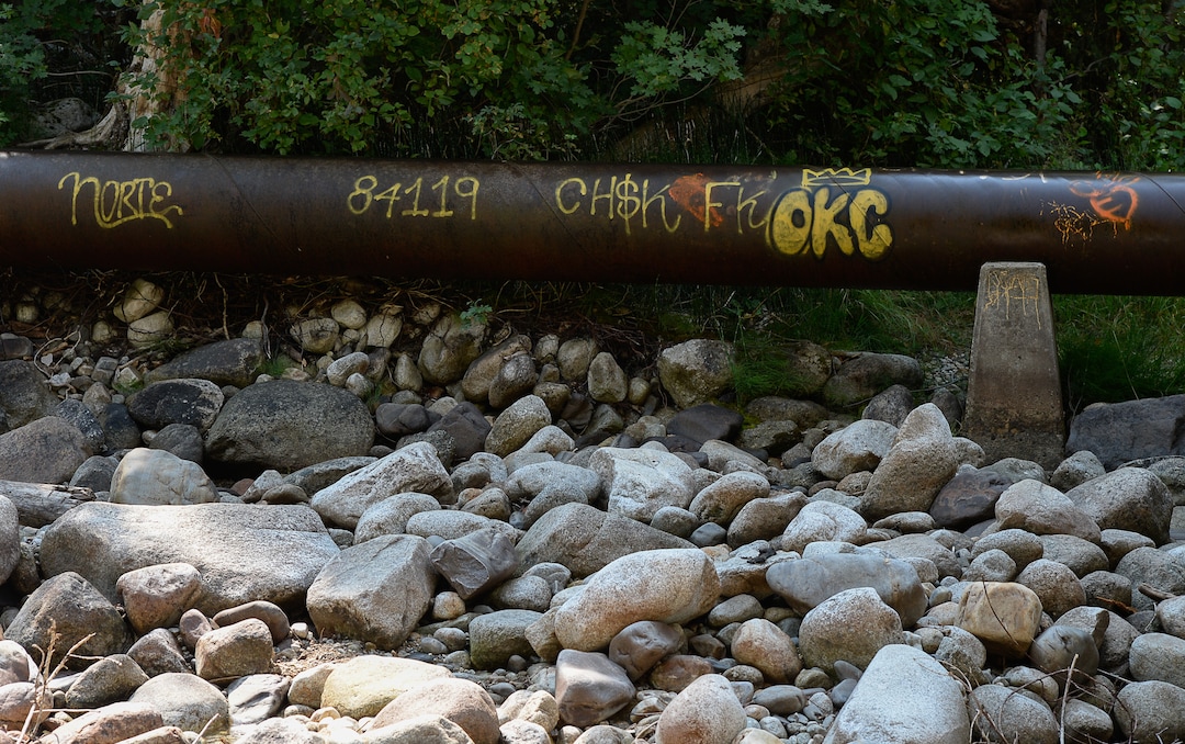 (Francisco Kjolseth  |  The Salt Lake Tribune)  Graffiti has proliferated in lower Little Cottonwood Canyon, where vandals, often wielding cans of fluorescent-colored spray paint, have covered granite faces, trees and structures. The vandalism is particularly apparent along the Temple Quarry Trail and the creek at the Moon Rock swimming hole and former pavilion site. Volunteers using donated equipment and solvents spend thousands of hours removing the paint from the rocks only to see graffiti return to the same faces or on rock nearby.