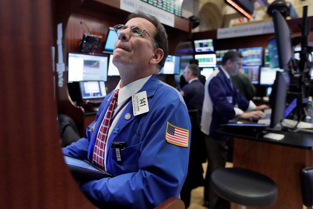 Trader Sal Suarino, left, works on the floor of the New York Stock Exchange, Monday, Jan. 11, 2016. U.S. stocks are opening higher as the market shakes off the latest drop in China. (AP Photo/Richard Drew)