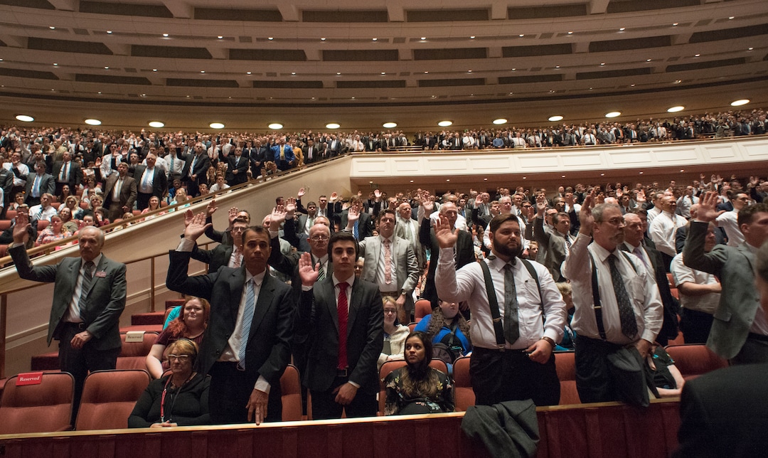 (Rick Egan  |  The Salt Lake Tribune)         LDS men stand to sustain President Russell M. Nelson and the first presidency of the church, during a  Solemn Assembly in the Saturday morning session of the 188th Annual General Conference in Salt Lake City,  Saturday, March 31, 2018.