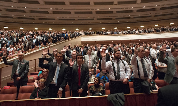 (Rick Egan  |  The Salt Lake Tribune)         LDS men stand to sustain President Russell M. Nelson and the first presidency of the church, during a  Solemn Assembly in the Saturday morning session of the 188th Annual General Conference in Salt Lake City,  Saturday, March 31, 2018.