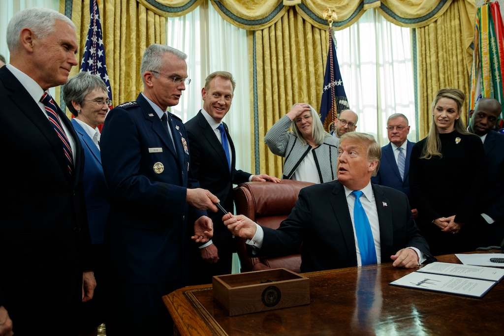 (Evan Vucci  |  AP Photo)  President Donald Trump hands a pen to Air Force Gen. Paul Selva after signing "Space Policy Directive 4" in the Oval Office of the White House, Tuesday, Feb. 19, 2019, in Washington.