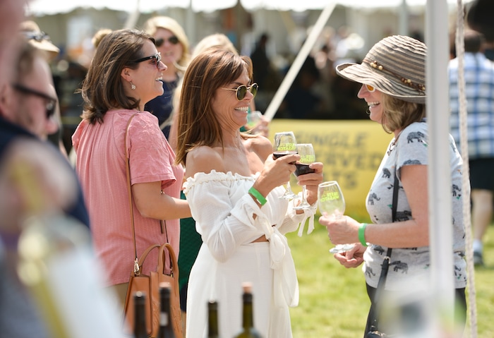 Leah Hogsten | The Salt Lake Tribune "If I hadn't bought my tickets, I wouldn't have come," said Daneen Adams (center) of the annual Taste of the Wasatch food and wine event Sunday, August 5, 2018 at Solitude. Adams is the Open Doors Program executive assistant director, a community action program to aid the Davis County Food Bank. Many attendees were conflicted after learning that tens of thousands of dollars in proceeds were funneled to the host organization and its leader instead of being donated to its non-profit charity, Utahns Against Hunger, but decided to attend anyway since no refunds would be given.
