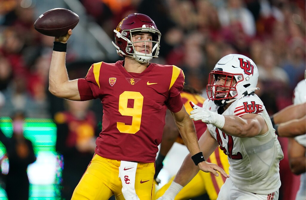 Southern California quarterback Kedon Slovis throws under pressure from Utah defensive end Mika Tafua (42) during the first half of an NCAA college football game Saturday, Oct. 9, 2021, in Los Angeles. (AP Photo/Marcio Jose Sanchez)