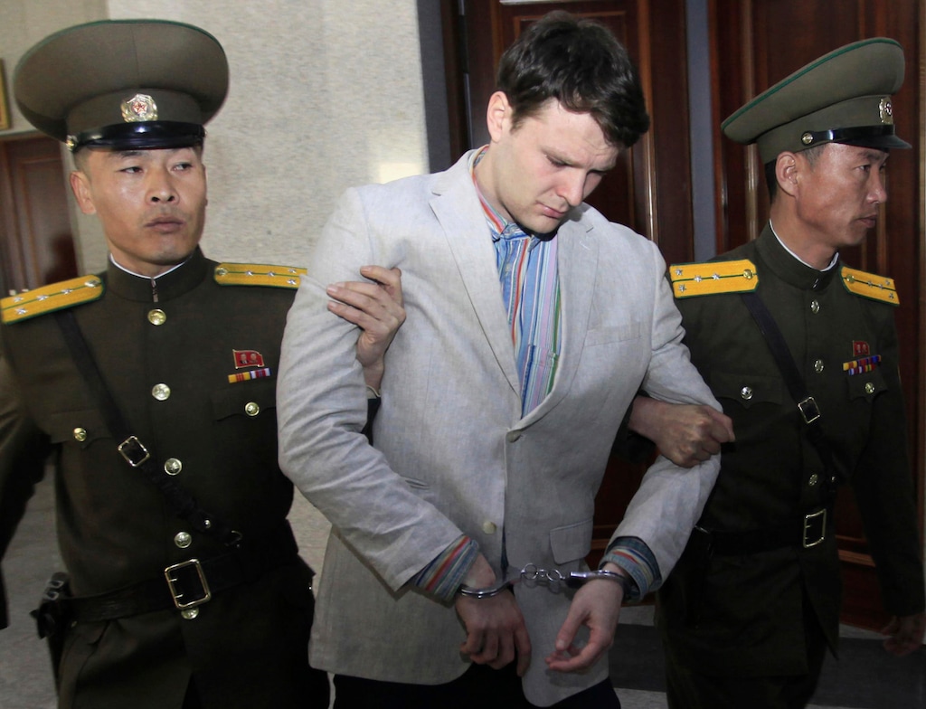 (Jon Chol Jin | AP file photo)
American student Otto Warmbier, center, is escorted at the Supreme Court in Pyongyang, North Korea, in 2016. Warmbier's parents have filed a claim for the North Korean cargo ship seized in May 2019 by the United States in a bid to collect a $500 million judgment awarded in the American college student's death. Otto Warmbier was imprisoned in North Korea for months after being convicted of trying to steal a propaganda poster and died days after being returned to the U.S. in a vegetative state in June 2017.