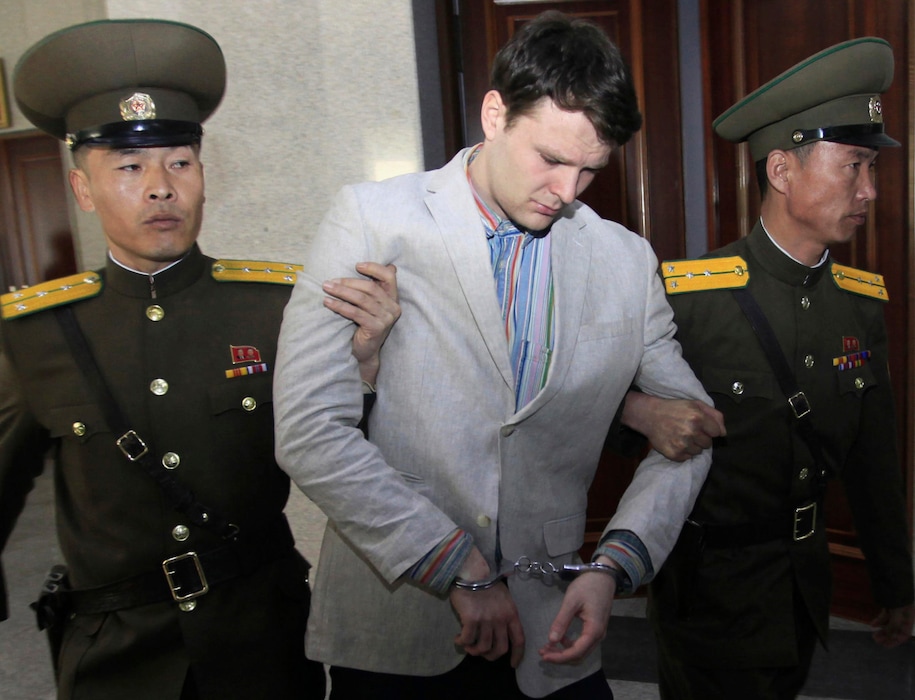 (Jon Chol Jin | AP file photo)
American student Otto Warmbier, center, is escorted at the Supreme Court in Pyongyang, North Korea, in 2016. Warmbier's parents have filed a claim for the North Korean cargo ship seized in May 2019 by the United States in a bid to collect a $500 million judgment awarded in the American college student's death. Otto Warmbier was imprisoned in North Korea for months after being convicted of trying to steal a propaganda poster and died days after being returned to the U.S. in a vegetative state in June 2017.