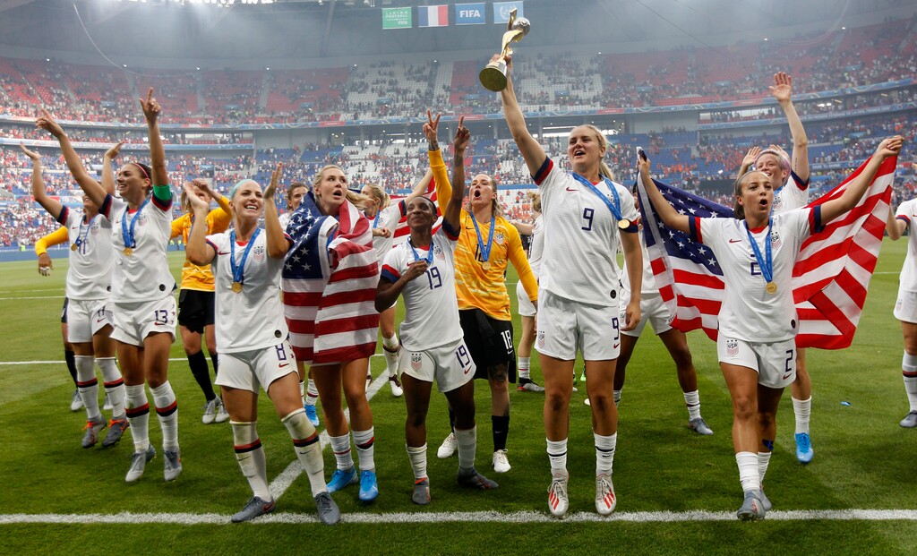 (Claude Paris | AP) United States' players jump to celebrate with the trophy after winning the Women's World Cup final soccer match between US and The Netherlands at the Stade de Lyon in Decines, outside Lyon, France, Sunday, July 7, 2019.
