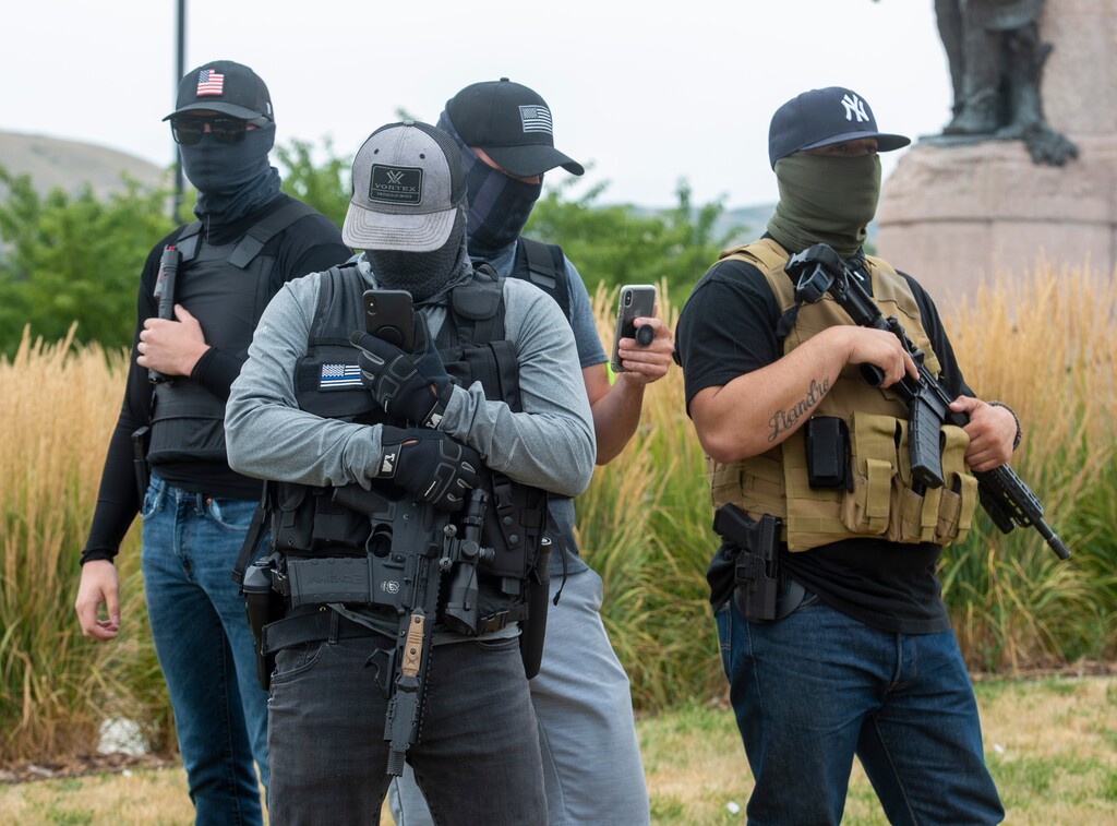 (Rick Egan  |  The Salt Lake Tribune)  More than 20 armed men showed up at the State Capitol grounds, where a handful of protesters were protesting recent violence in Portland, on Wednesday, July 22, 2020.