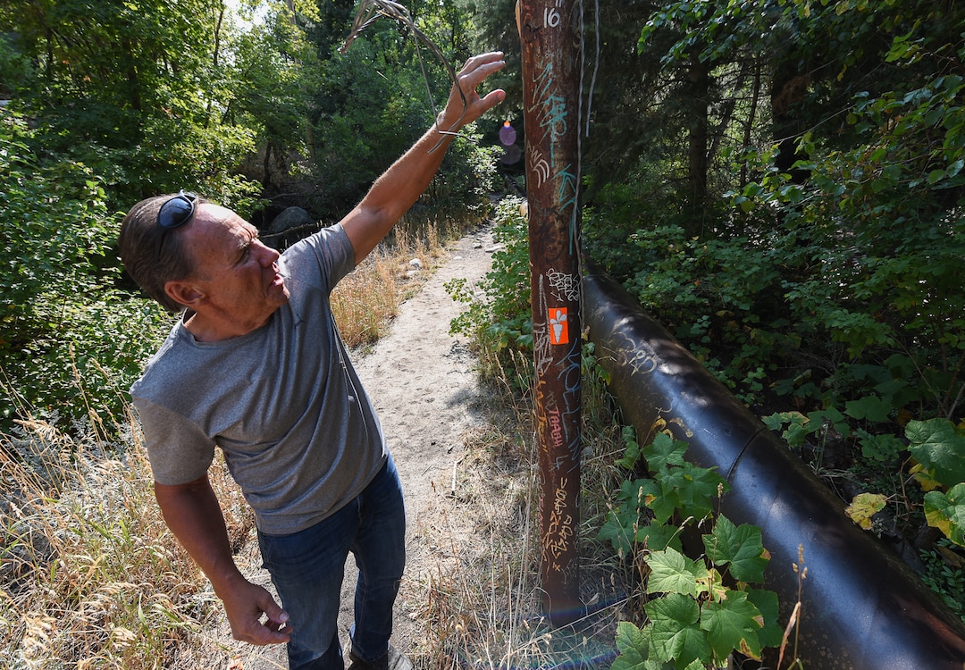 (Francisco Kjolseth  |  The Salt Lake Tribune)  Graffiti has proliferated in lower Little Cottonwood Canyon, where vandals, often wielding cans of fluorescent-colored spray paint, have covered granite faces, trees and structures. The vandalism is particularly apparent along the Temple Quarry Trail and the creek at the Moon Rock swimming hole and former pavilion site. Volunteers using donated equipment and solvents spend thousands of hours removing the paint from the rocks only to see graffiti return to the same faces or on rock nearby.
