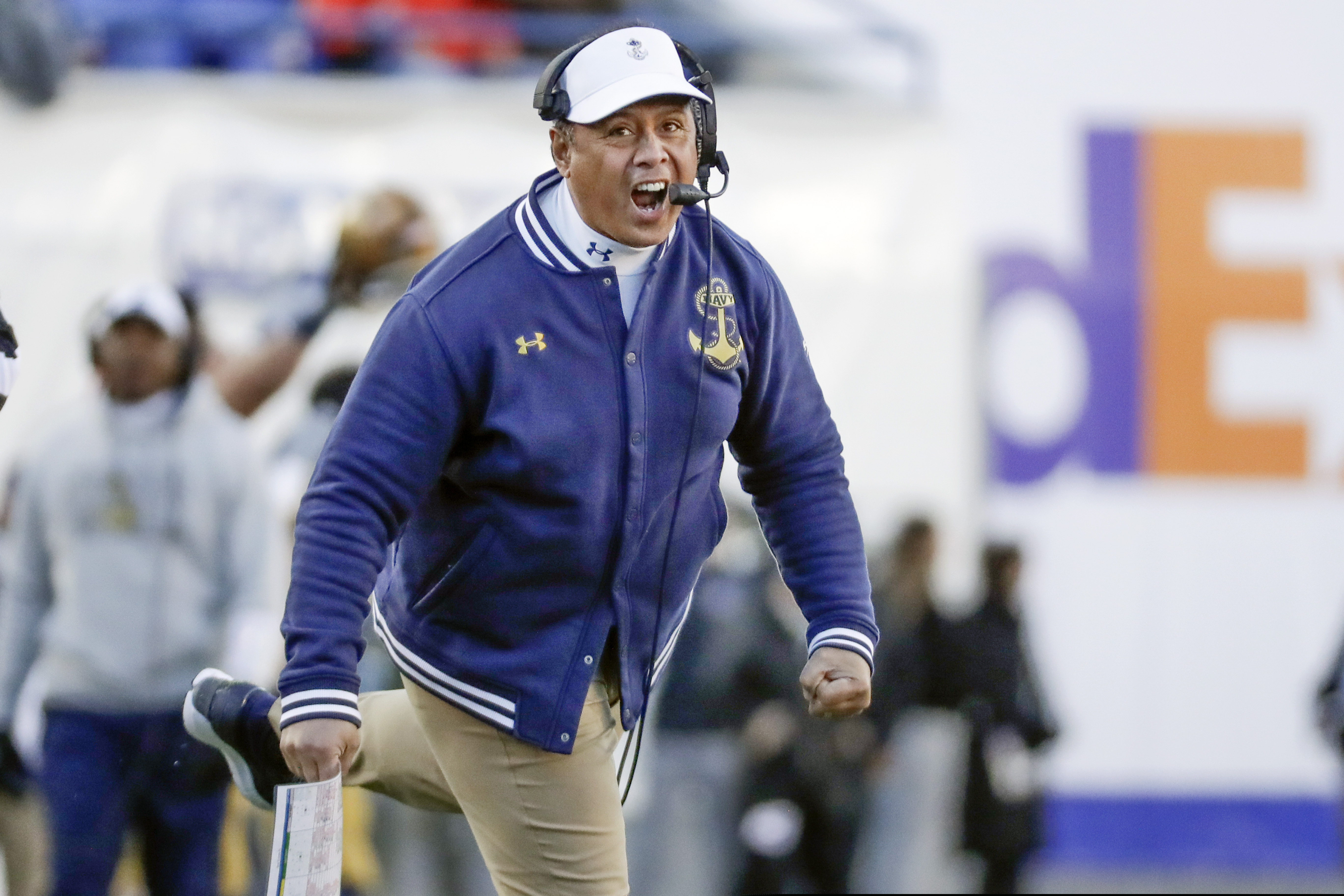 FILE - In this Dec. 31, 2019 file photo, Navy head coach Ken Niumatalolo cheers his team on in the first half of the Liberty Bowl NCAA college football game against Kansas State in Memphis, Tenn.  For the first time since 1989, Navy and Brigham Young University will get together for a football game at the Naval Academy in Annapolis, Md., on Monday, Sept. 7, 2020.  (AP Photo/Mark Humphrey, File)
