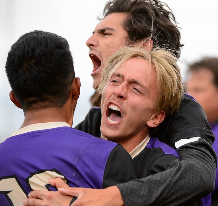 (Trent Nelson | The Salt Lake Tribune)  Desert Hills players celebrate their win over Park City High School, Saturday May 12, 2018.