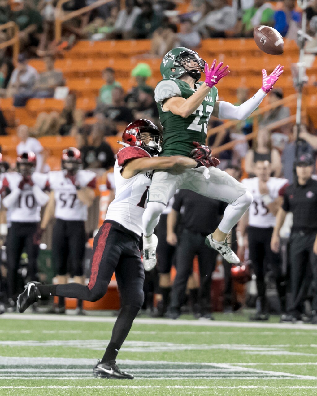 San Diego State cornerback Ron Smith, left, breaks up a pass intended for Hawaii wide receiver Dylan Collie (23) in the second quarter of an NCAA college football game, Saturday, Oct. 28, 2017, in Honolulu. (AP Photo/Eugene Tanner)