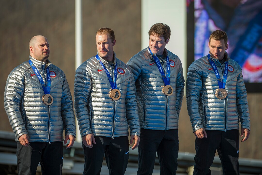 KRASNAYA POLYANA, RUSSIA  - JANUARY 23:USA's Steven Holcomb, Chris Fogt, Curtis Tomasevicz, and Steve Langton, celebrate during the medal ceremony at the finish of the four-man bobsled at Sanki Sliding Center during the 2014 Sochi Olympics Sunday February 23, 2014. They won the bronze medal with a cumulative time of 3:40.99. (Photo by Chris Detrick/The Salt Lake Tribune)