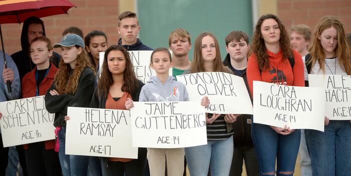 (Al Hartmann  |  The Salt Lake Tribune) 	
About 80 students at Westlake High School in Saratoga Springs left class and stood together in silence at the front entrance of the school Wednesday March 14, 2018 to remember the 17 students who died in a school shooting in Florida.  They held posters of the names of those killed. 