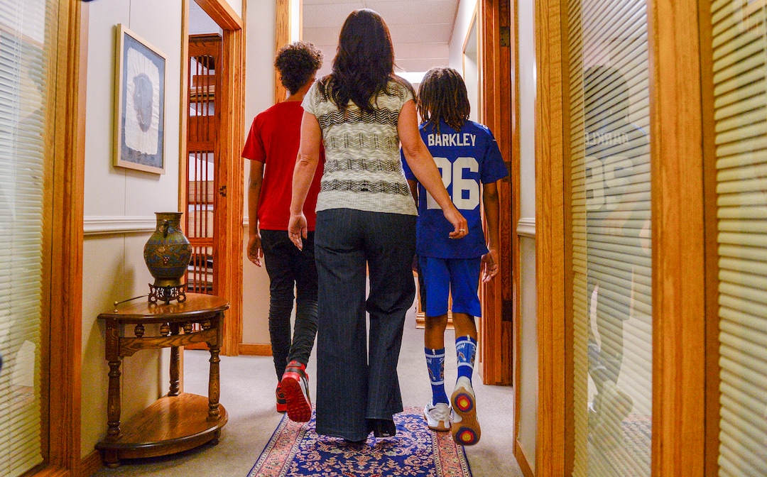 Leah Hogsten  |  The Salt Lake Tribune   Brenda Mayes walks with her two sons, both referred to as Òchild doeÓ and Òstudent 2Ó in the lawsuit she filed, Tuesday, May 7, 2019 against the Davis School District, accusing a bus driver of racial discrimination against her son, left.