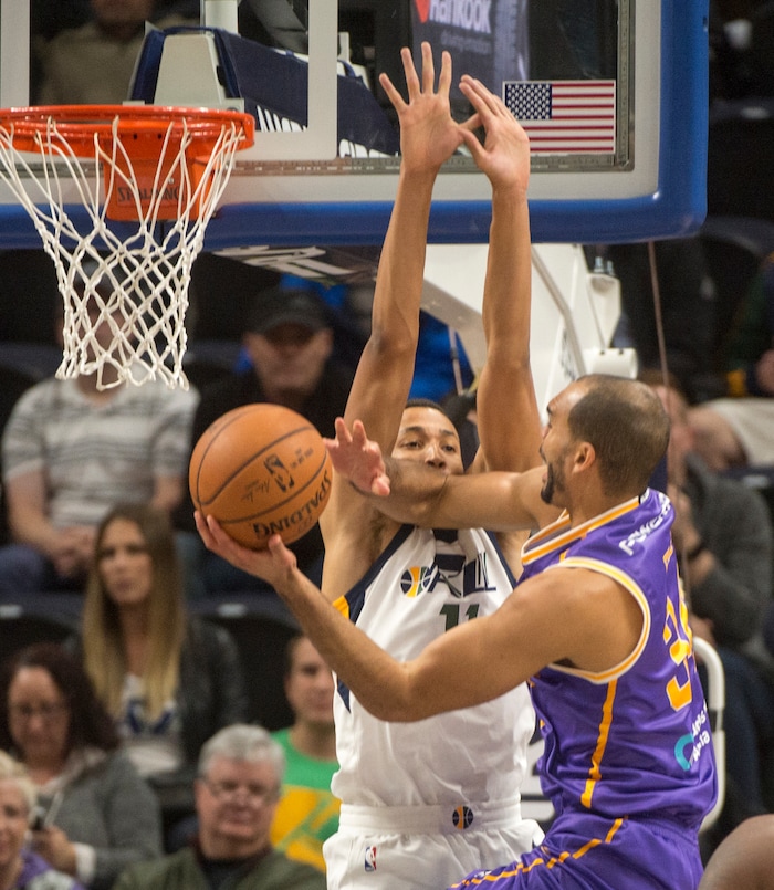 (Rick Egan  |  The Salt Lake Tribune) Sydney Kings guard Perry Ellis (34) goes to the hoop as Utah Jazz guard Dante Exum (11) defends, in preseason basketball Utah Jazz vs. Sydney Kings, in Salt Lake City, Sunday, October 2, 2017.


