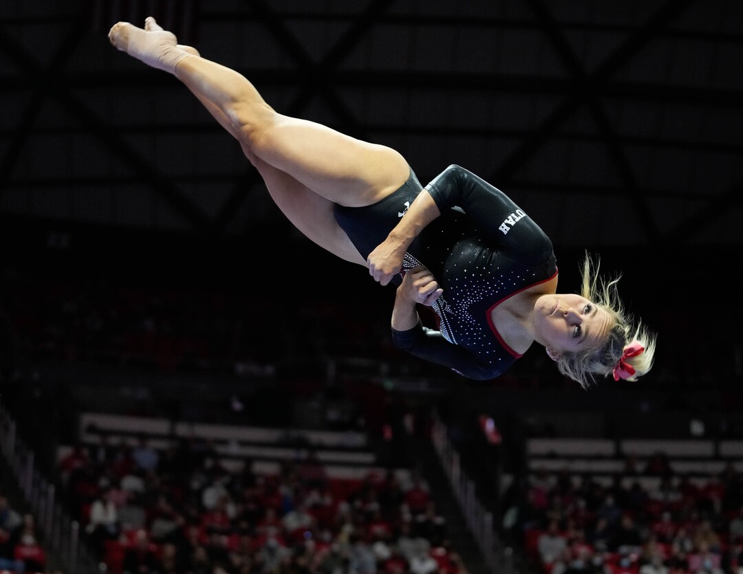 (Francisco Kjolseth | The Salt Lake Tribune) Utah’s Adrianne Randall dismounts the beam during their gymnastics meet with Stanford at the Huntsman Center in Salt Lake City, Saturday, Jan. 29, 2022.