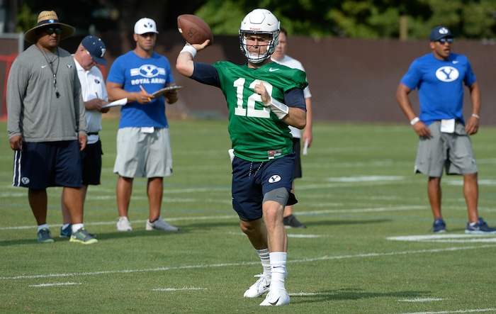 (Francisco Kjolseth  |  The Salt Lake Tribune)  BYU quarterback Tanner Mangum runs through drills as the team opens preseason training camp on their practice field on Thursday, Aug. 2, 2018.