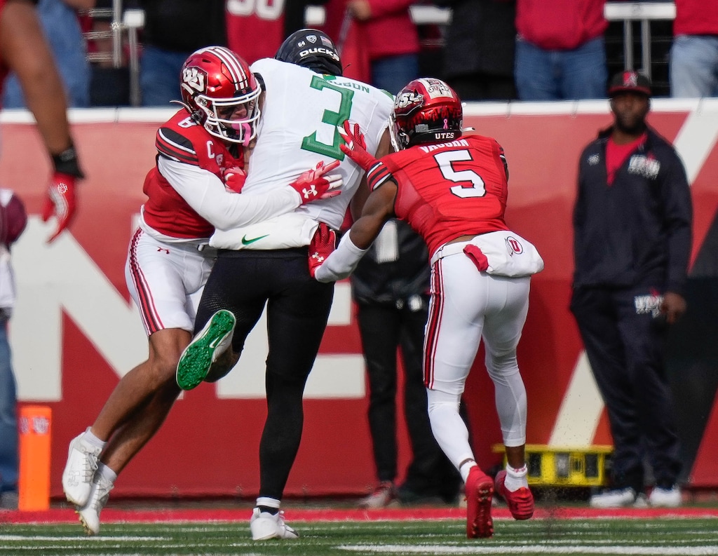 (Francisco Kjolseth  |  The Salt Lake Tribune) Utah Utes safety Cole Bishop (8) and Utah Utes cornerback Zemaiah Vaughn (5) move in on Oregon Ducks tight end Terrance Ferguson (3) as the Utah Utes host the Oregon Ducks, NCAA football in Salt Lake City on Saturday, Oct. 28, 2023.