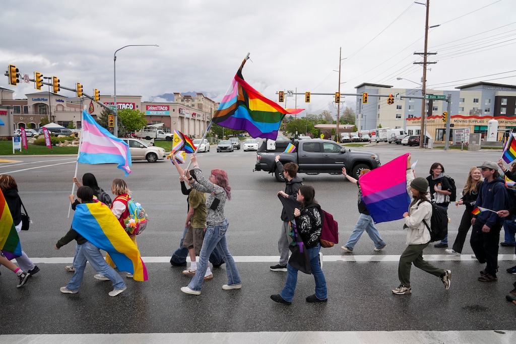 (Bethany Baker | The Salt Lake Tribune) Murray High School students march along State Street during a walkout in response to HB77, a bill that bans flags celebrating the LGBTQ community in schools and government property, in Murray on Wednesday, April 30, 2025.