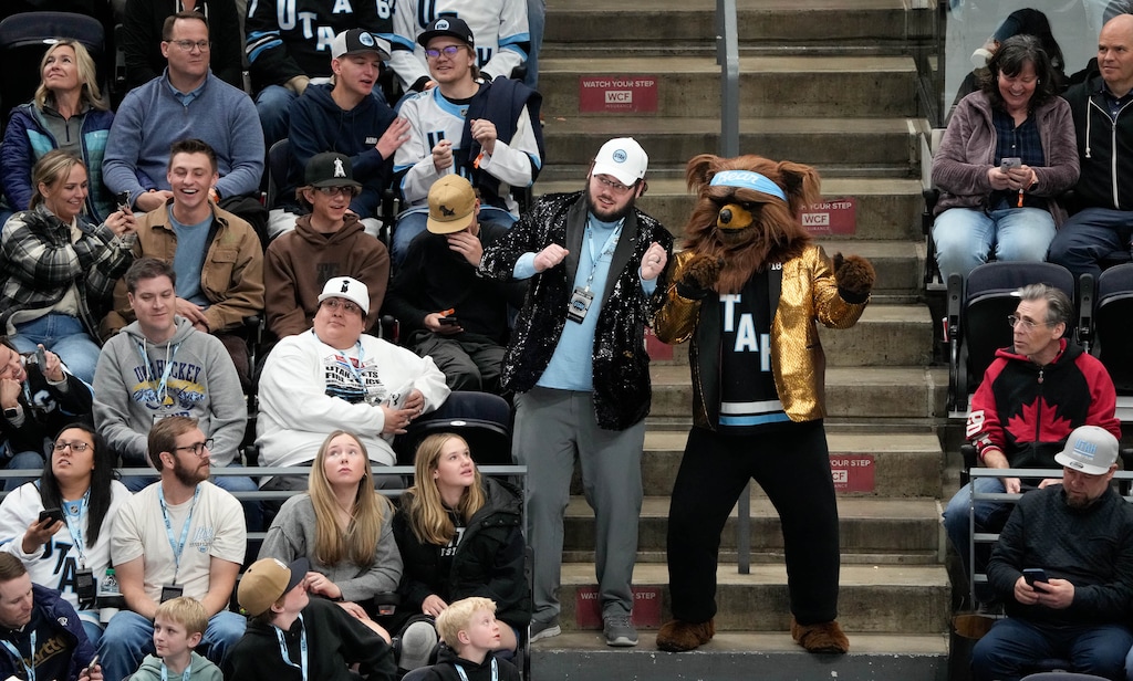 (Francisco Kjolseth  | The Salt Lake Tribune) The Jazz Bear sparkles alongside Cord Stroh as they dance during an NHL hockey game at the Delta Center in Salt Lake City on Monday, March 10, 2025.