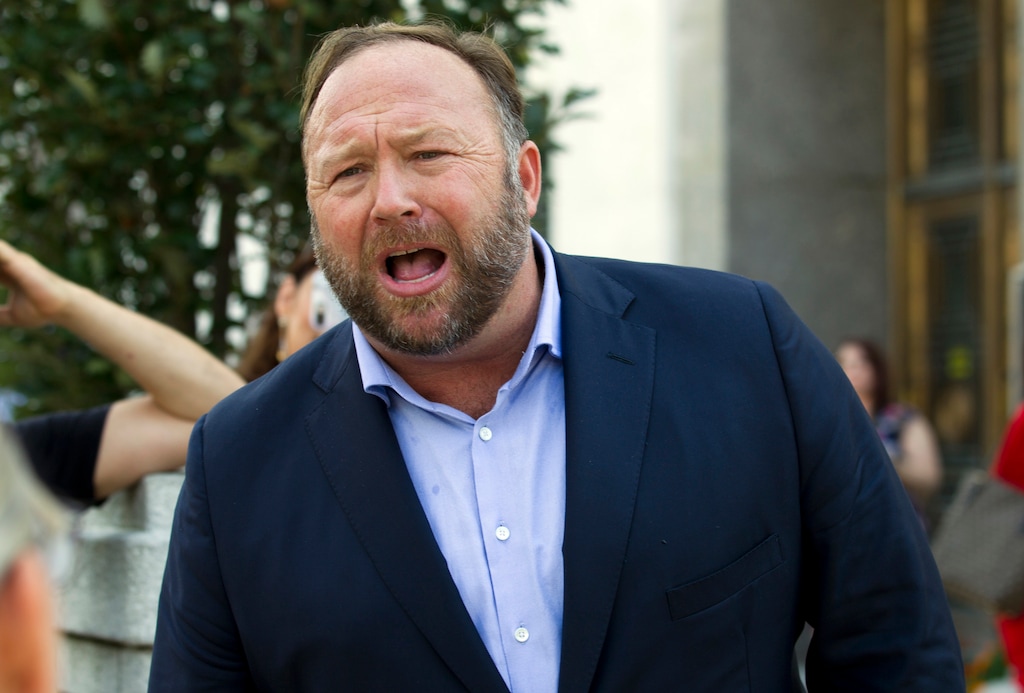 FILE- In this Sept. 5, 2018, file photo conspiracy theorist Alex Jones speaks outside of the Dirksen building of Capitol Hill after listening to Facebook COO Sheryl Sandberg and Twitter CEO Jack Dorsey testify before the Senate Intelligence Committee on 'Foreign Influence Operations and Their Use of Social Media Platforms' on Capitol Hill in Washington. Twitter is permanently banning right-wing conspiracy theorist Jones and his “Infowars” show for abusive behavior. (AP Photo/Jose Luis Magana, File)